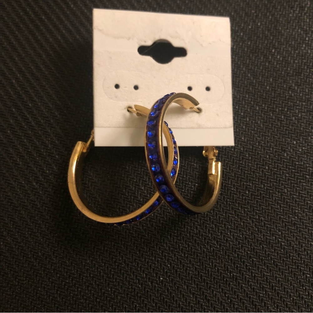 Small gold hoop earrings with blue rhinestones